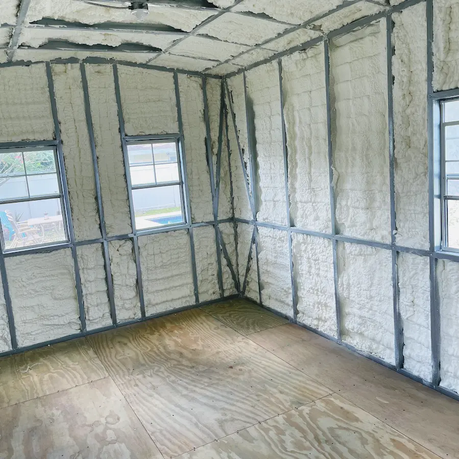 Closed-cell spray foam insulation applied to wall cavities in a residential project in Primera